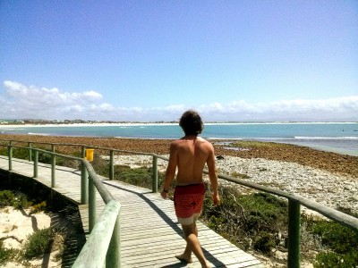 a walk on a wooden bridge to the beach