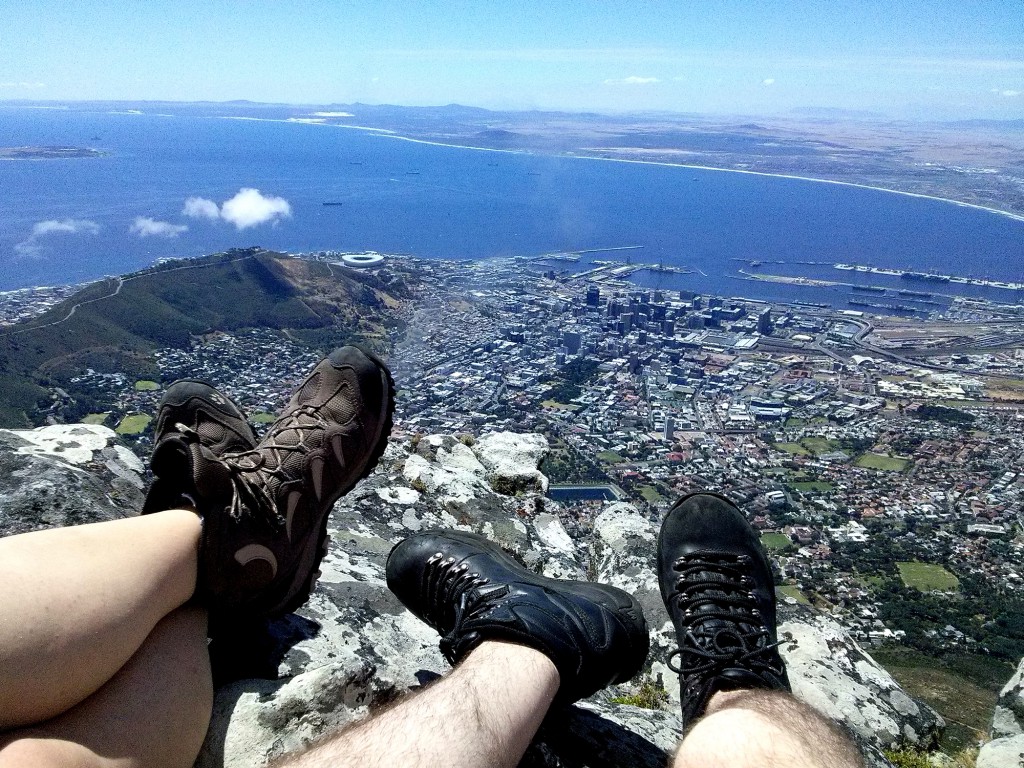 Shoes feets ontop of table mountain