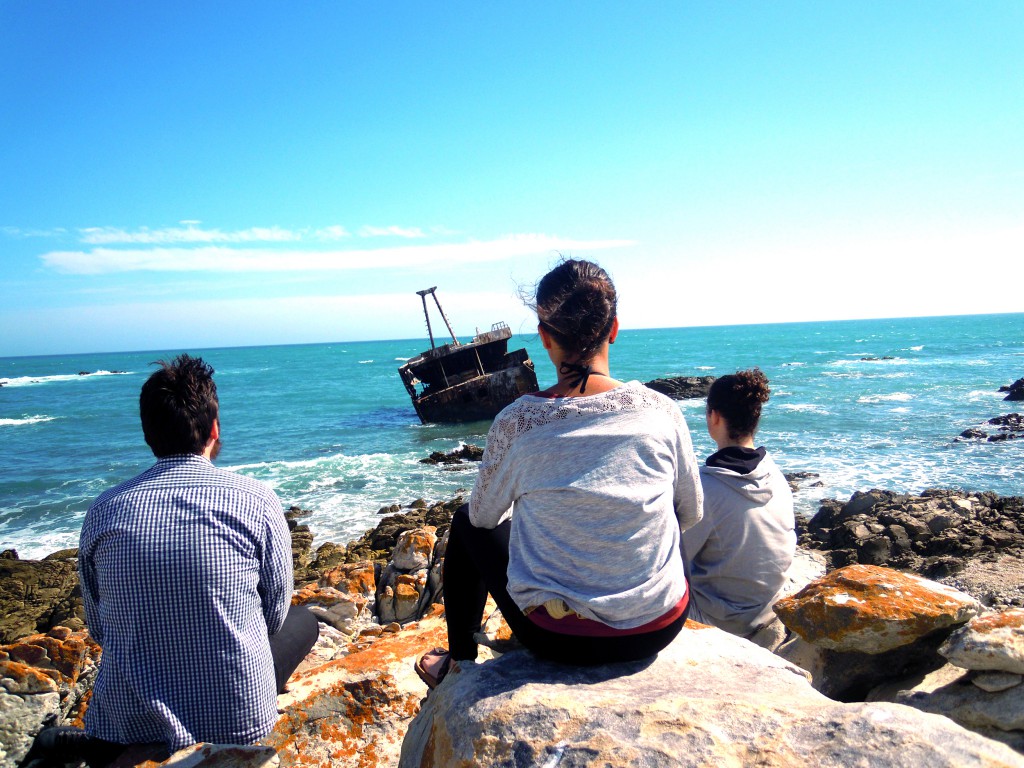 sitting and watching the shipwreck on the beach