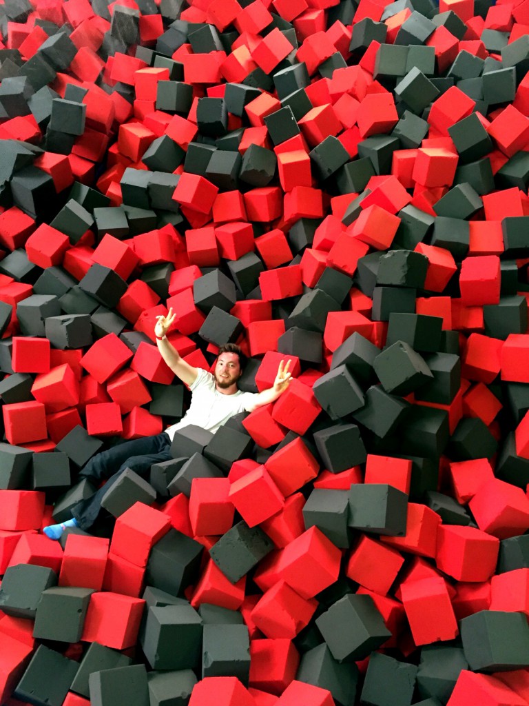 sitting in the foam after a trampoline jump red black